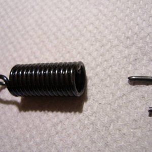 Snapped tensioner spring.